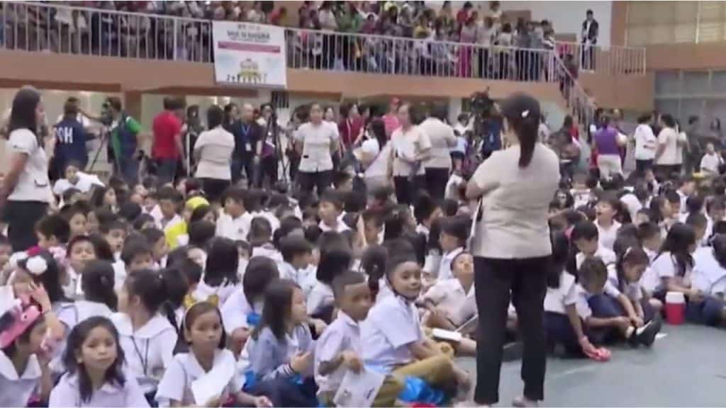 Students gathered in a gym